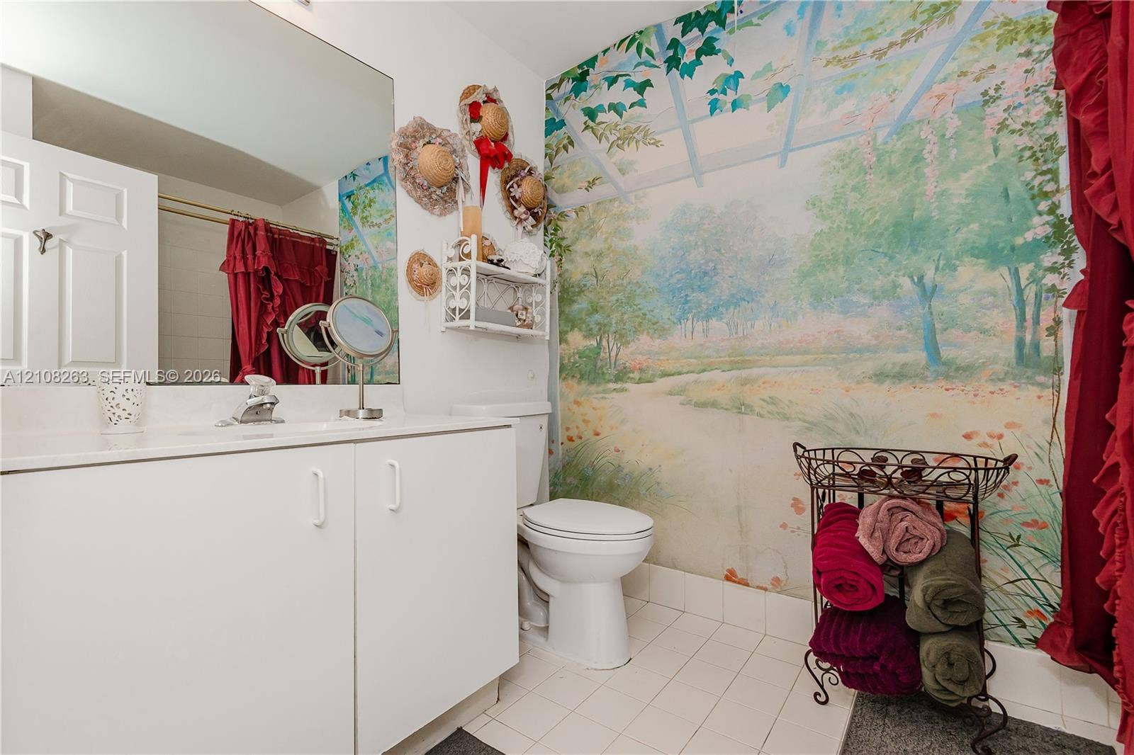 14817 Balgowan Road, #102-5, Miami Lakes, FL 33016 Bathroom featuring a white vanity cabinet, a large wall-mounted mirror, a porcelain toilet, and tile flooring