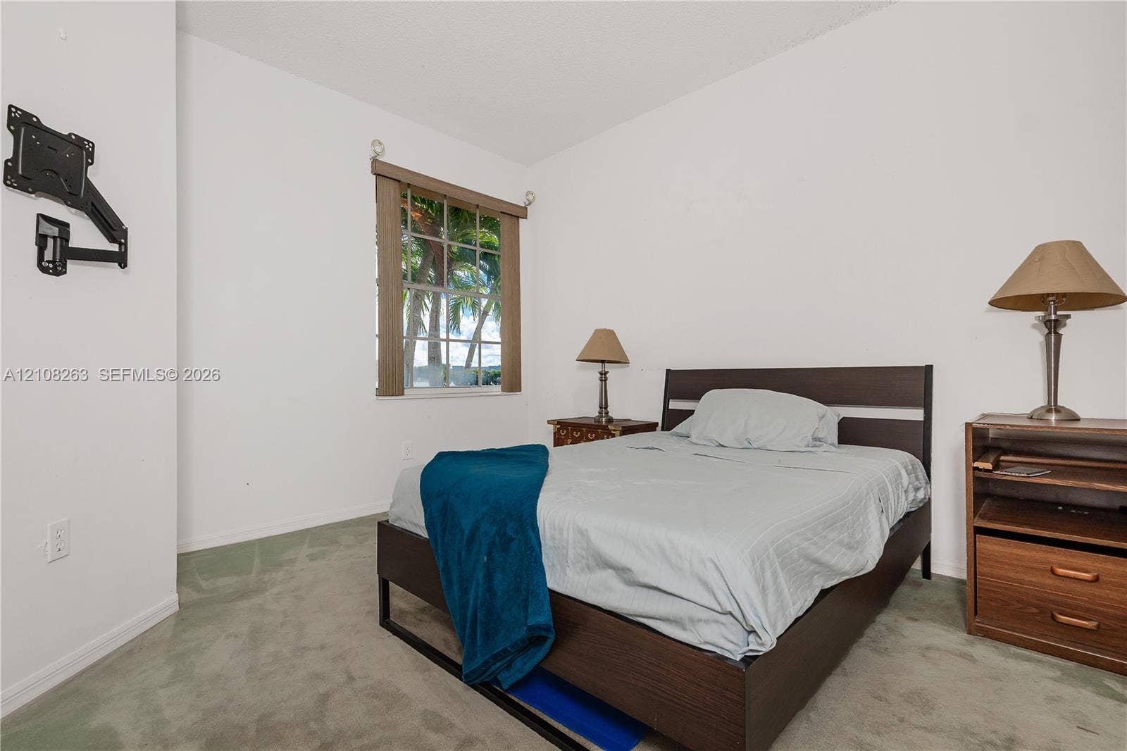 14817 Balgowan Road, #102-5, Miami Lakes, FL 33016 Bedroom interior featuring wall-to-wall carpeting and a multi-pane window with wood-finish blinds