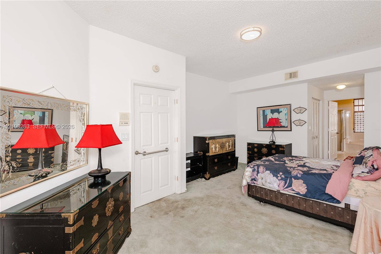 14817 Balgowan Road, #102-5, Miami Lakes, FL 33016 Room featuring neutral wall-to-wall carpeting, a six-panel interior door, and flush-mount ceiling lighting