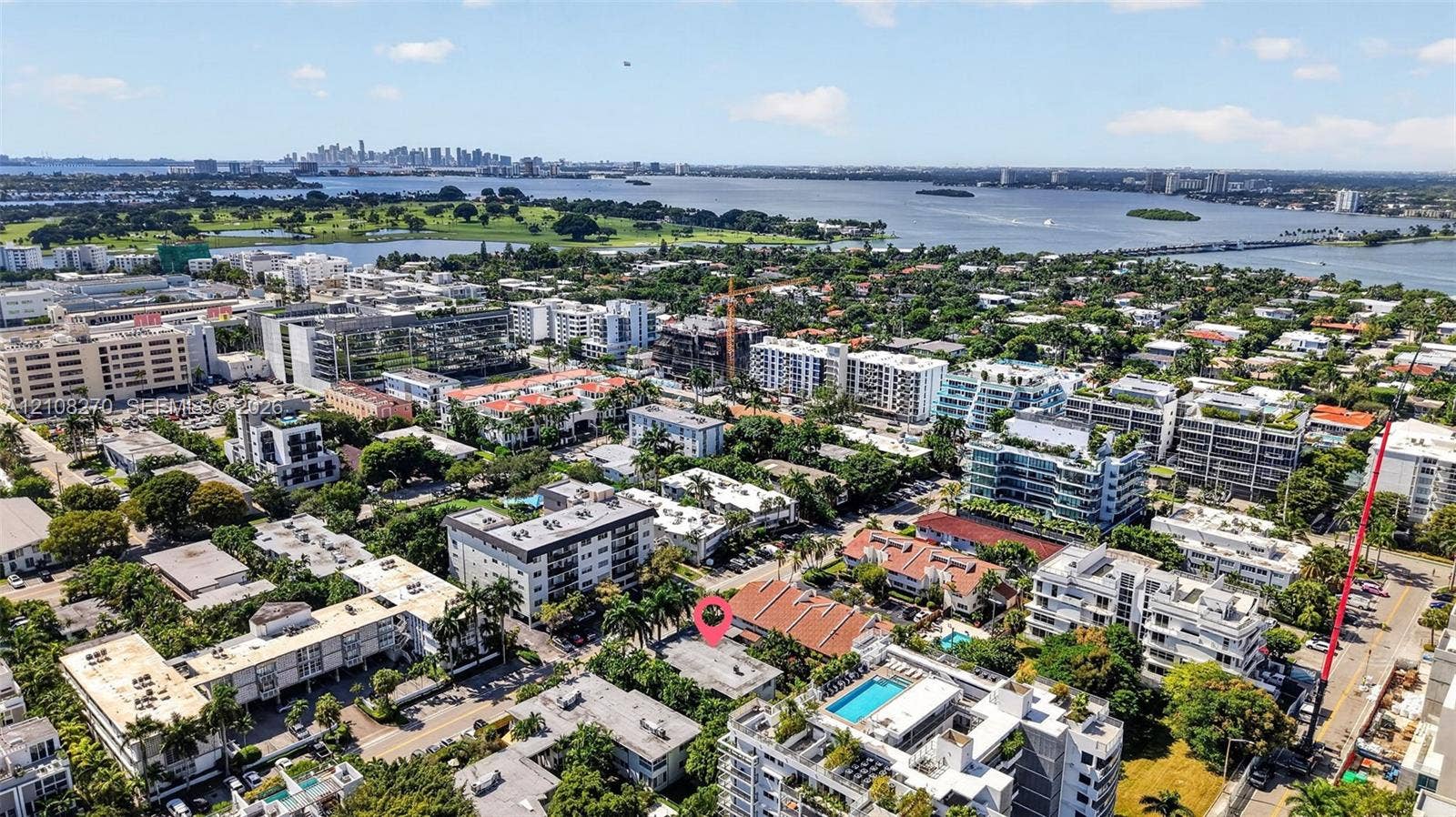 1125 99th Street, #12, Bay Harbor Islands, FL 33154 Aerial perspective of coastal neighborhood featuring mature palm trees and proximity to open water