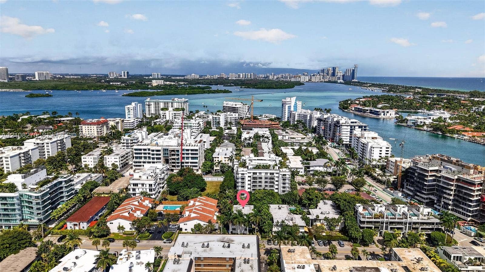 1125 99th Street, #12, Bay Harbor Islands, FL 33154 Aerial perspective featuring a waterfront location with immediate access to coastal waterways and dense tropical landscaping