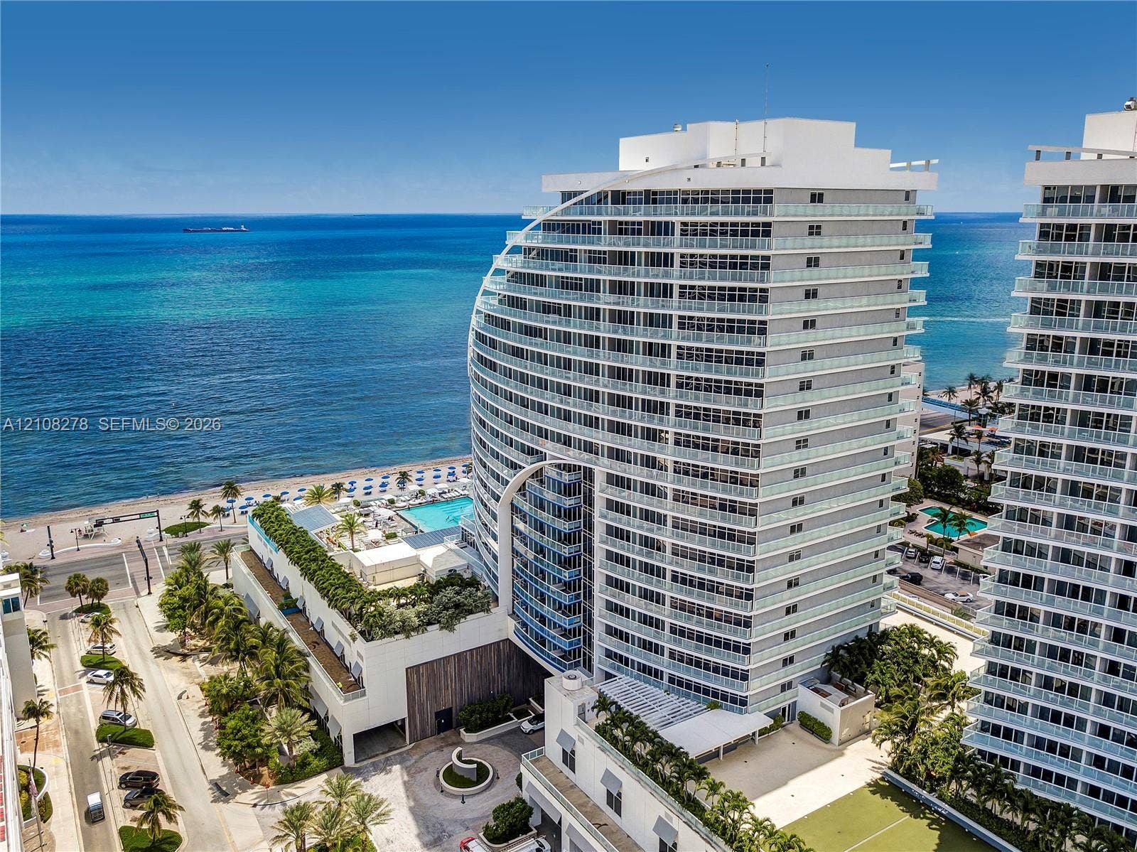 3101 Bayshore Drive, #701, Fort Lauderdale, FL 33304 High-rise architectural design with glass-railing balconies, coastal waterfront location, and integrated multi-level terraced landscaping