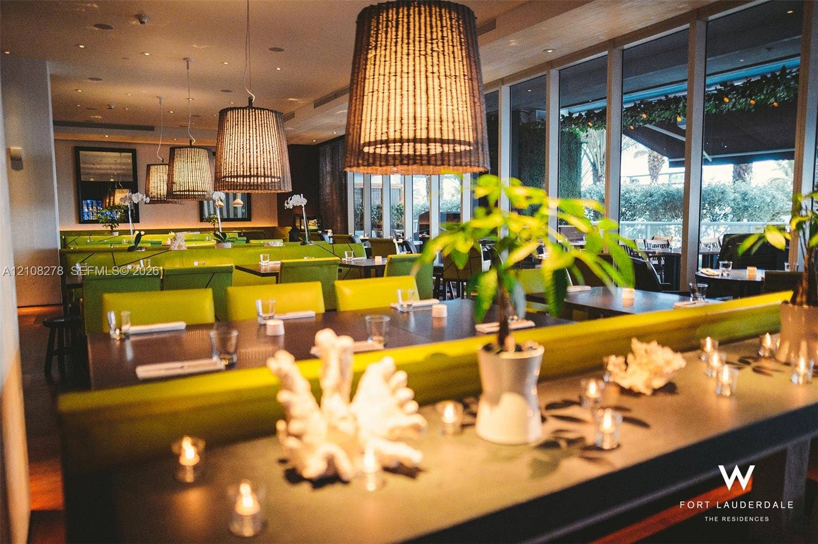 3101 Bayshore Drive, #701, Fort Lauderdale, FL 33304 Floor-to-ceiling windows, custom built-in bench seating, pendant lighting, and recessed ceiling lighting
