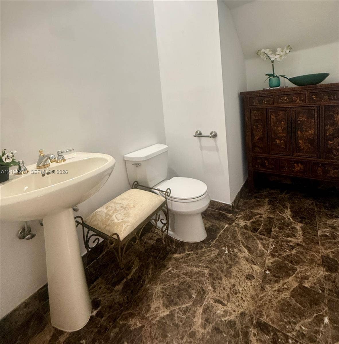19424 39th Avenue, Sunny Isles Beach, Sunny Isles Beach, FL 33160 Pedestal sink with metallic faucet, white toilet, and polished stone flooring