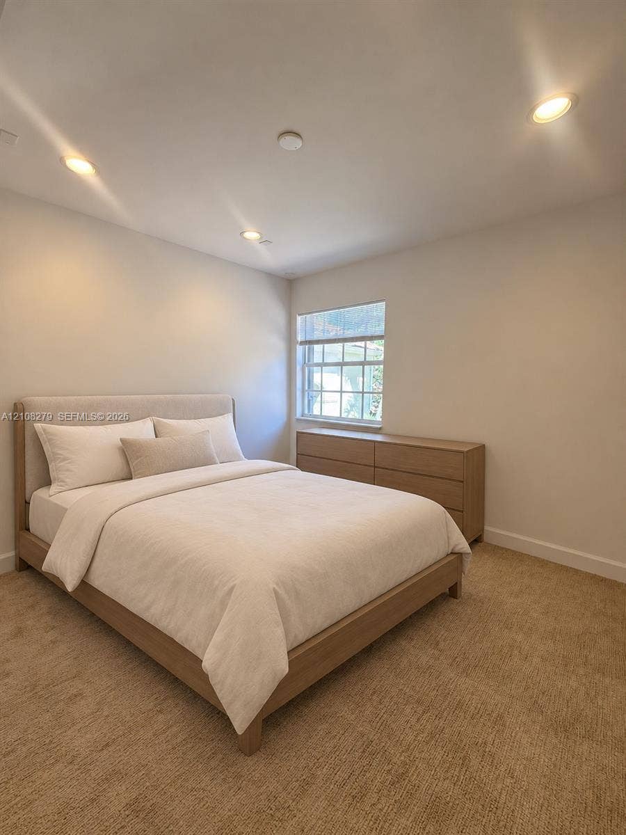 19424 39th Avenue, Sunny Isles Beach, Sunny Isles Beach, FL 33160 Neutral-toned interior featuring recessed lighting, wall-to-wall carpeting, and a multi-pane window