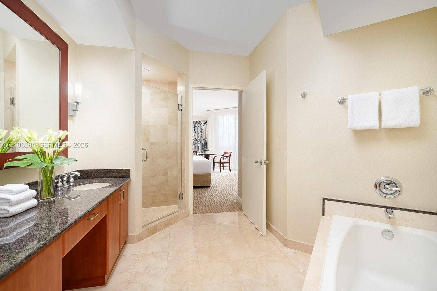 18001 Collins Avenue, #908, Sunny Isles Beach, FL 33160 Bathroom featuring a stone-surface vanity with undermount sink, walk-in tile shower with glass enclosure, deep soaking tub, and tile flooring
