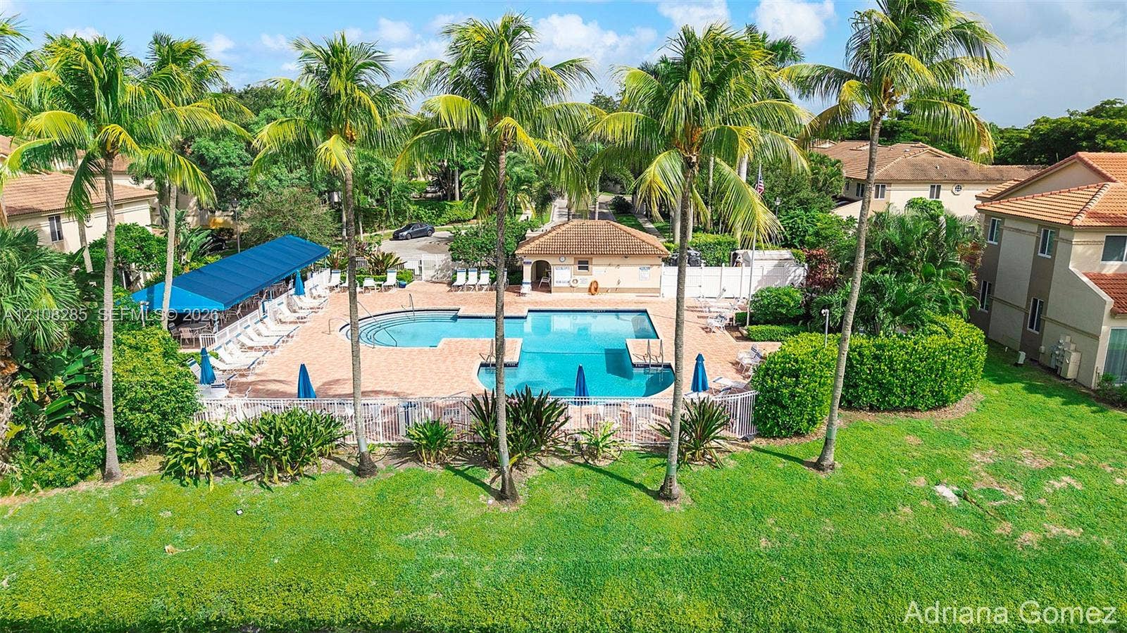 6626 Via Regina, #0, Boca Raton, Boca Raton, FL 33433 Outdoor swimming pool with brick-paver decking, covered pavilion, manicured landscaping, and tall palm trees
