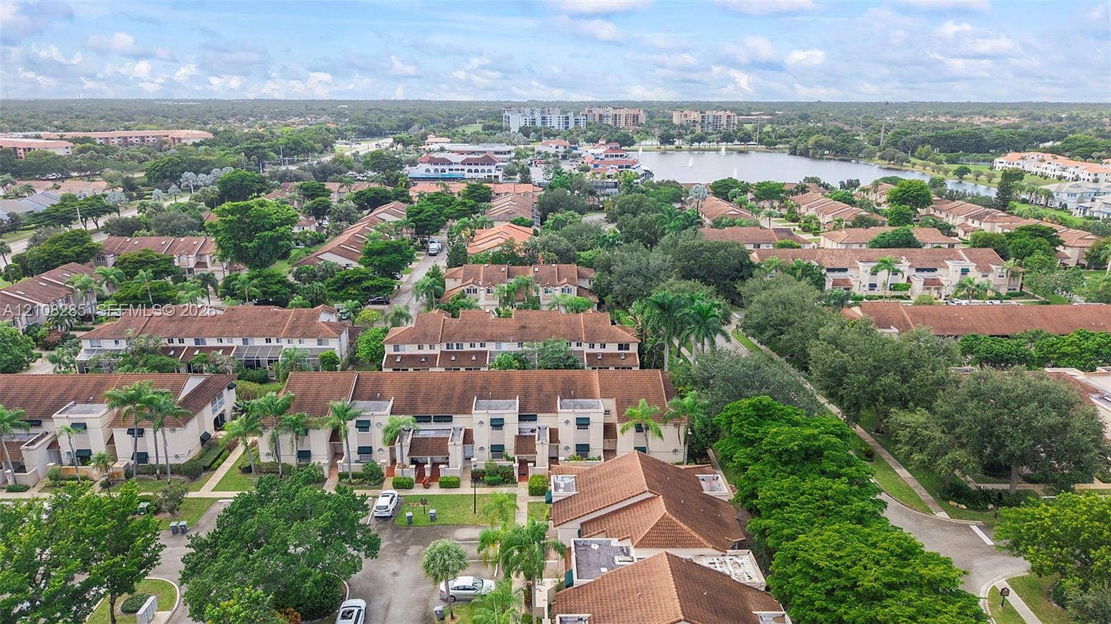 6626 Via Regina, #0, Boca Raton, Boca Raton, FL 33433 Aerial perspective of multi-family residences featuring tile roofing, stucco exteriors, mature landscaping, and tree-lined grounds