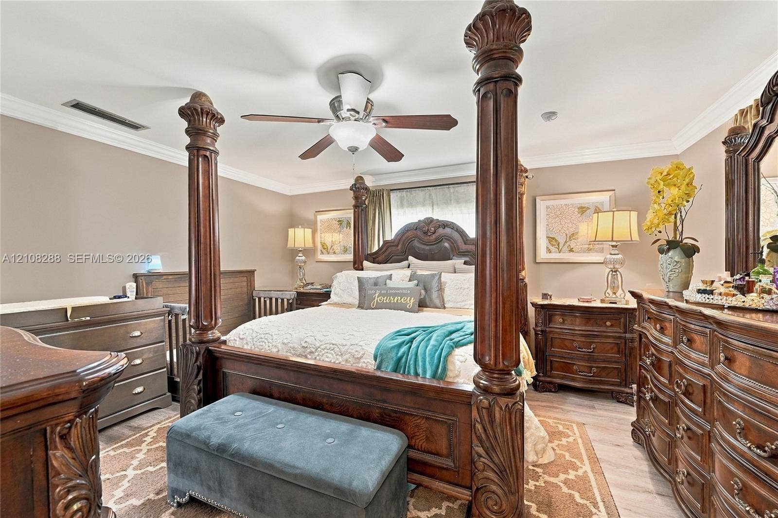 8292 NW 36th Street, Sunrise, FL 33351 Bedroom interior featuring crown molding, neutral wall paint, and a ceiling-mounted fan with integrated lighting