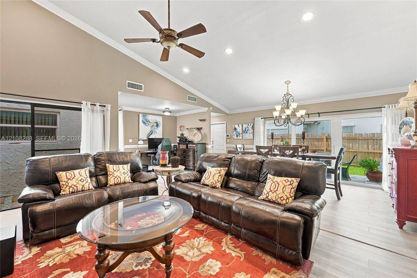 8292 NW 36th Street, Sunrise, FL 33351 Vaulted ceilings, recessed lighting, wood-finish flooring, ceiling fan, and sliding glass doors
