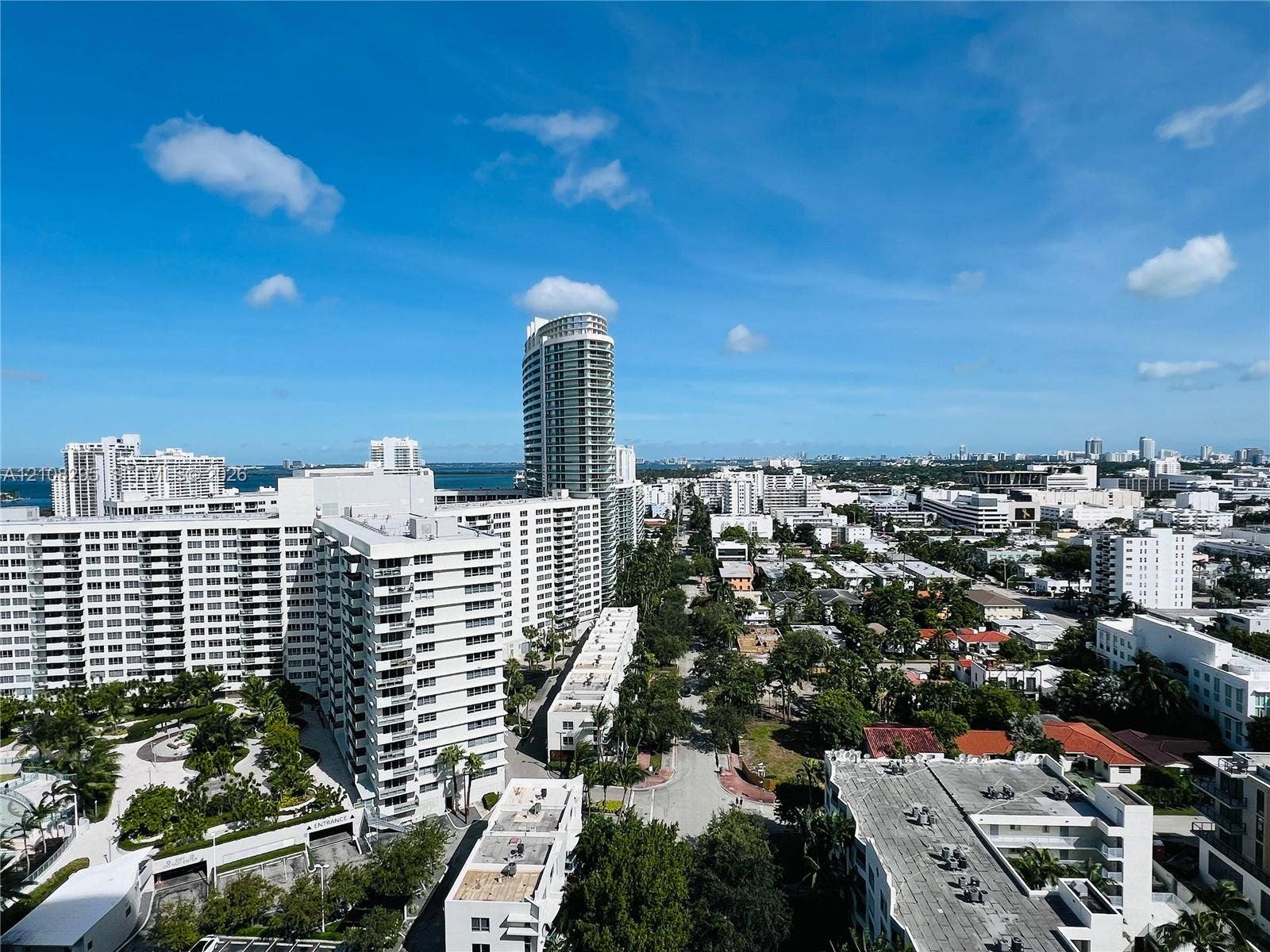 High-rise balcony perspective featuring panoramic cityscape and water horizons