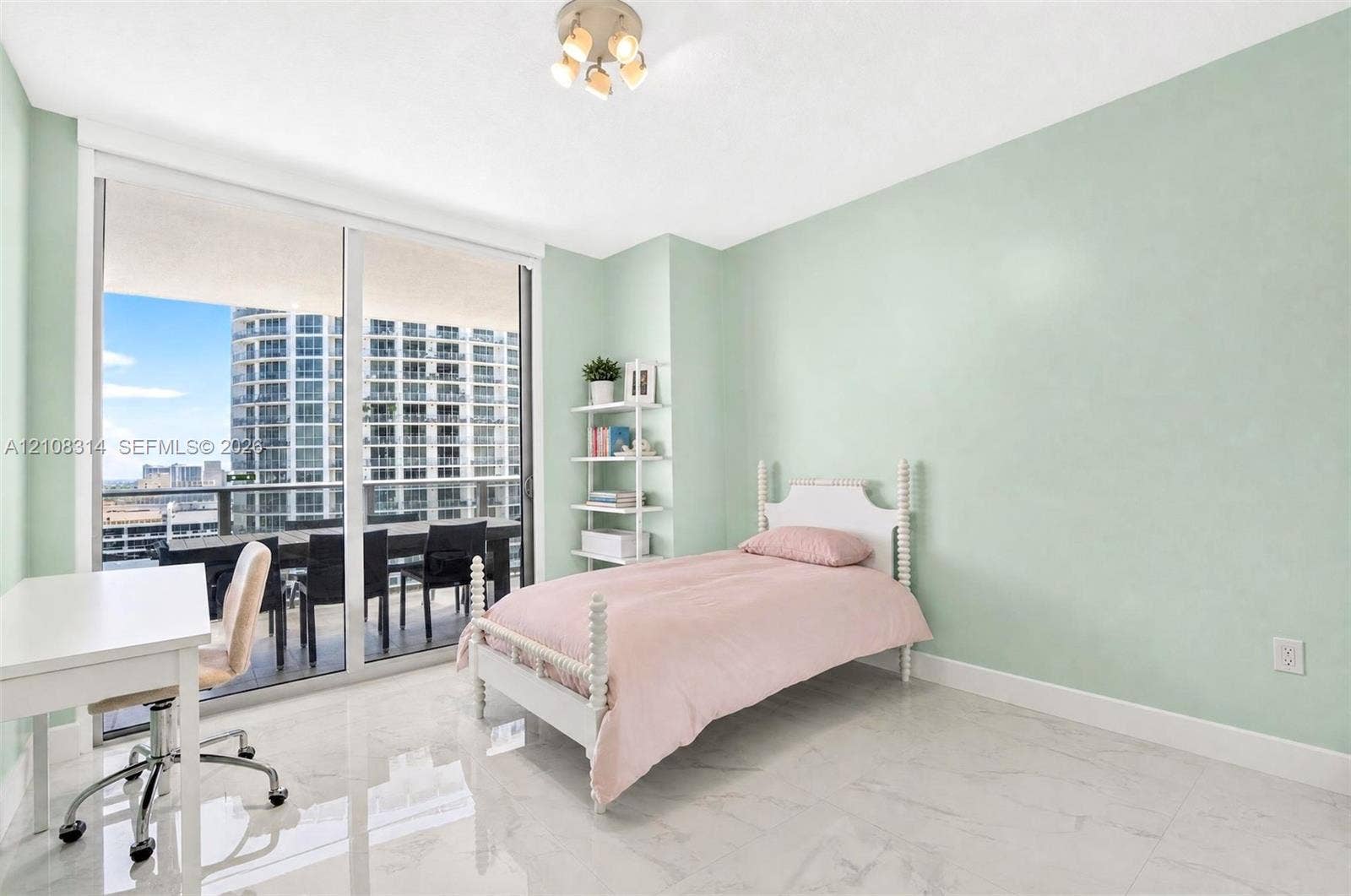 488 NE 18th Street, #4010, Miami, FL 33132 Floor-to-ceiling sliding glass doors, polished stone-finish flooring, and built-in shelving