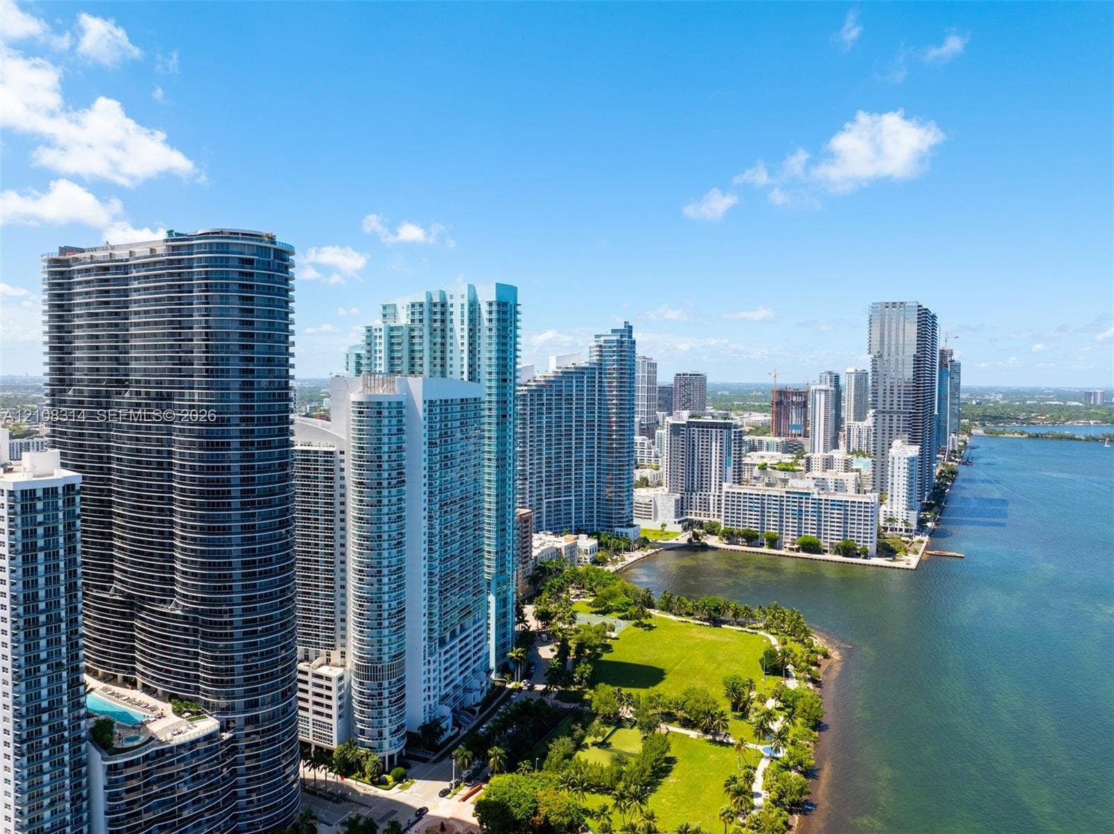 488 NE 18th Street, #4010, Miami, FL 33132 High-rise coastal cityscape featuring waterfront access, expansive green space, and architectural tower structures