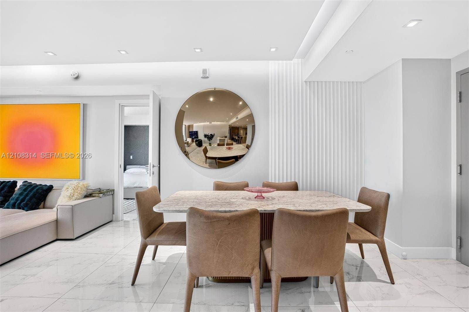 488 NE 18th Street, #4010, Miami, FL 33132 Polished stone-finish flooring, vertical fluted wall paneling, and recessed ceiling lighting