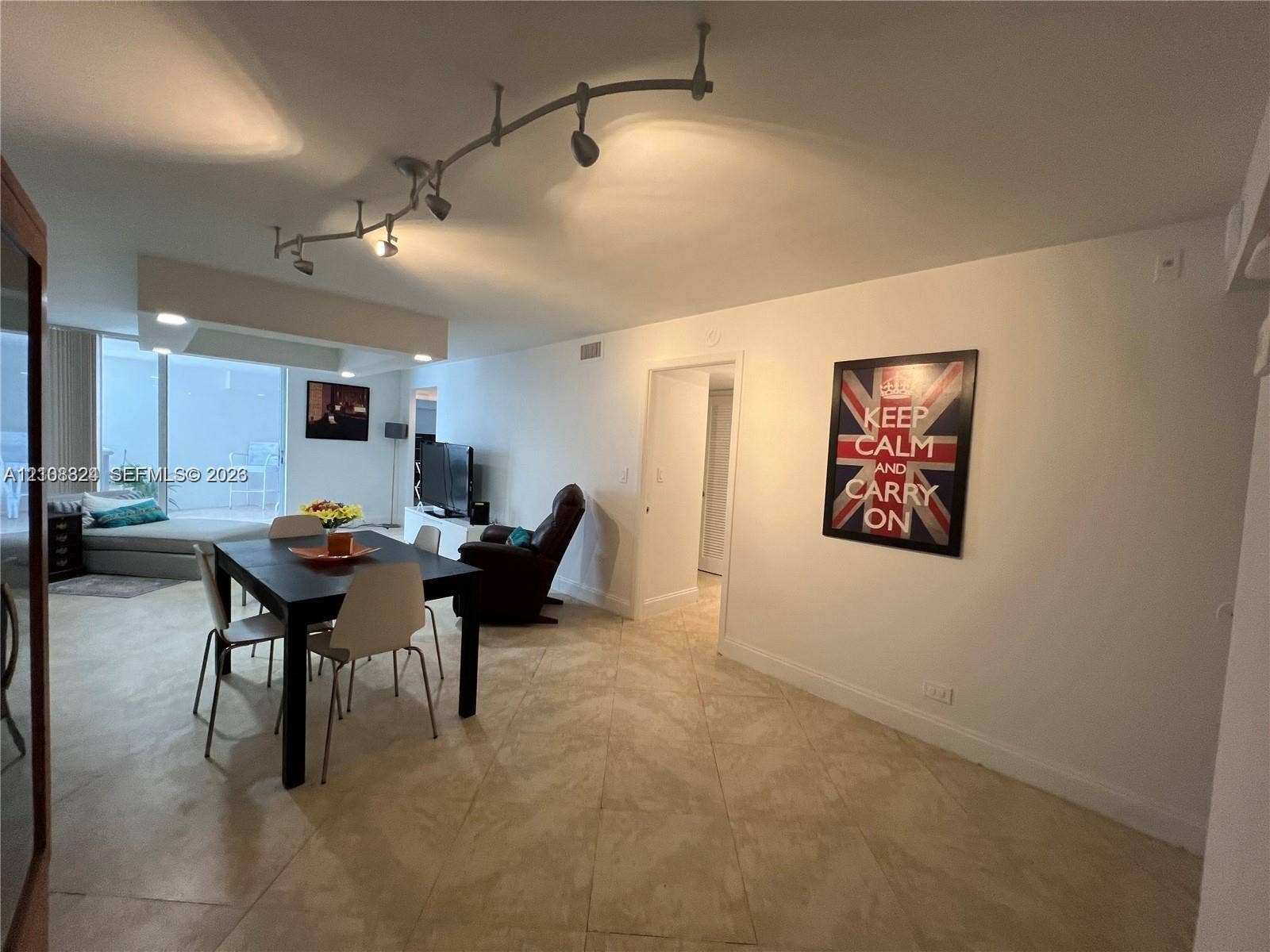 6039 Collins Avenue, #1208, Miami Beach, FL 33140 Large-format tile flooring, adjustable track lighting system, and floor-to-ceiling glass paneling