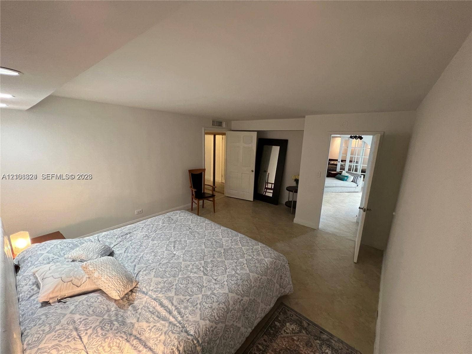 6039 Collins Avenue, #1208, Miami Beach, FL 33140 Neutral interior space featuring recessed ceiling lighting, light-toned tile flooring, and multiple doorways