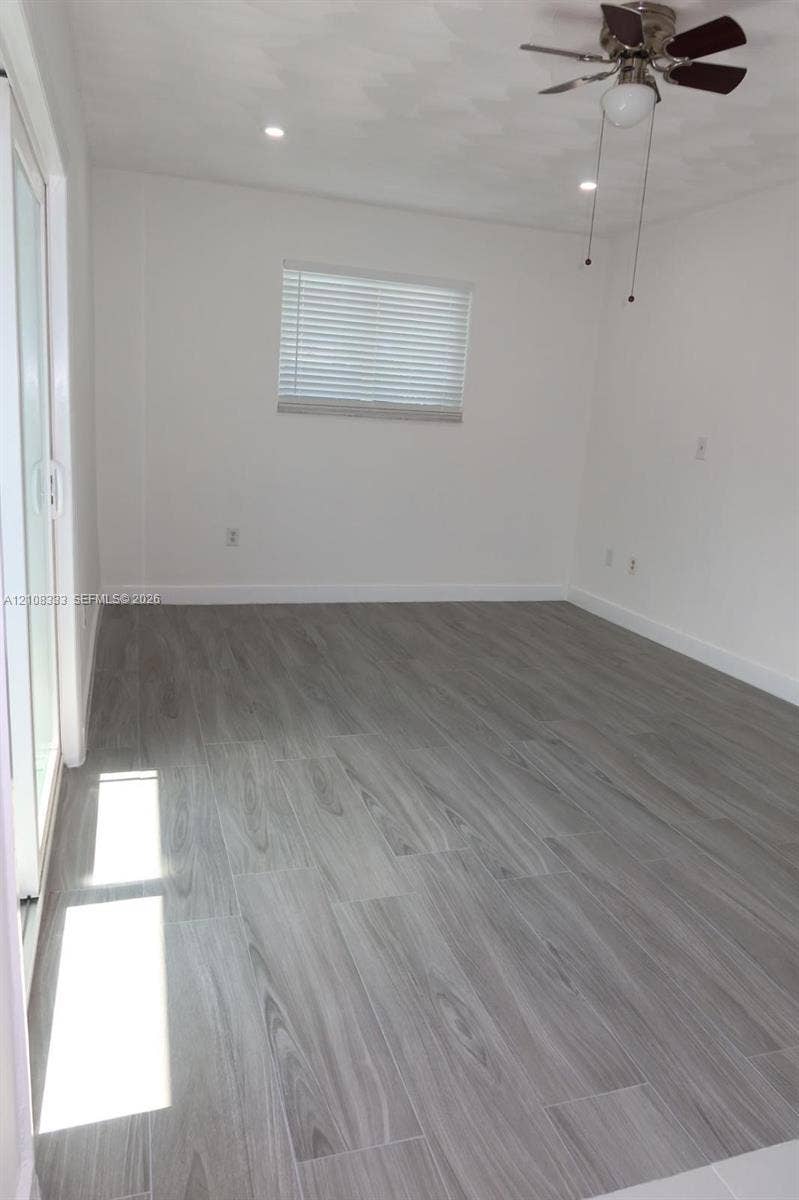 10450 SW 166th Terrace, #0, Miami, Miami, FL 33157 Wood-finish flooring, recessed lighting, ceiling fan with light fixture, and sliding glass door