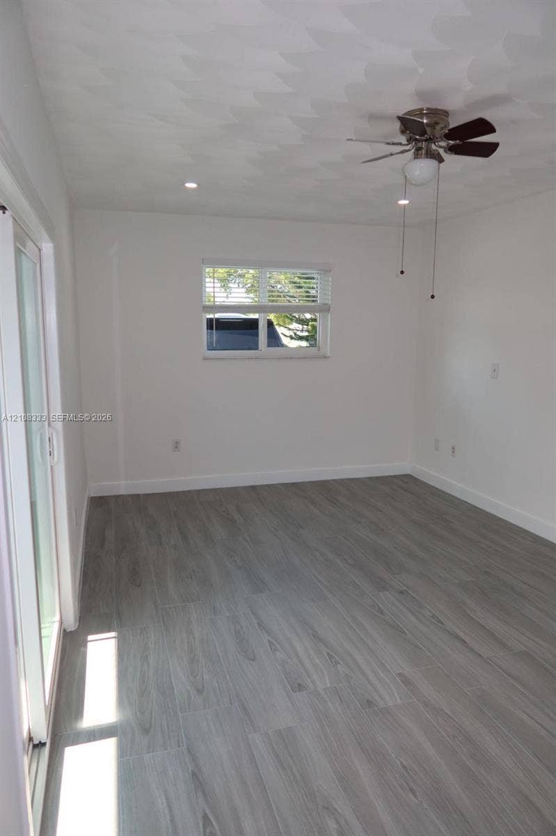 10450 SW 166th Terrace, #0, Miami, Miami, FL 33157 Room featuring wood-finish flooring, textured ceiling, ceiling fan, recessed lighting, and sliding glass door