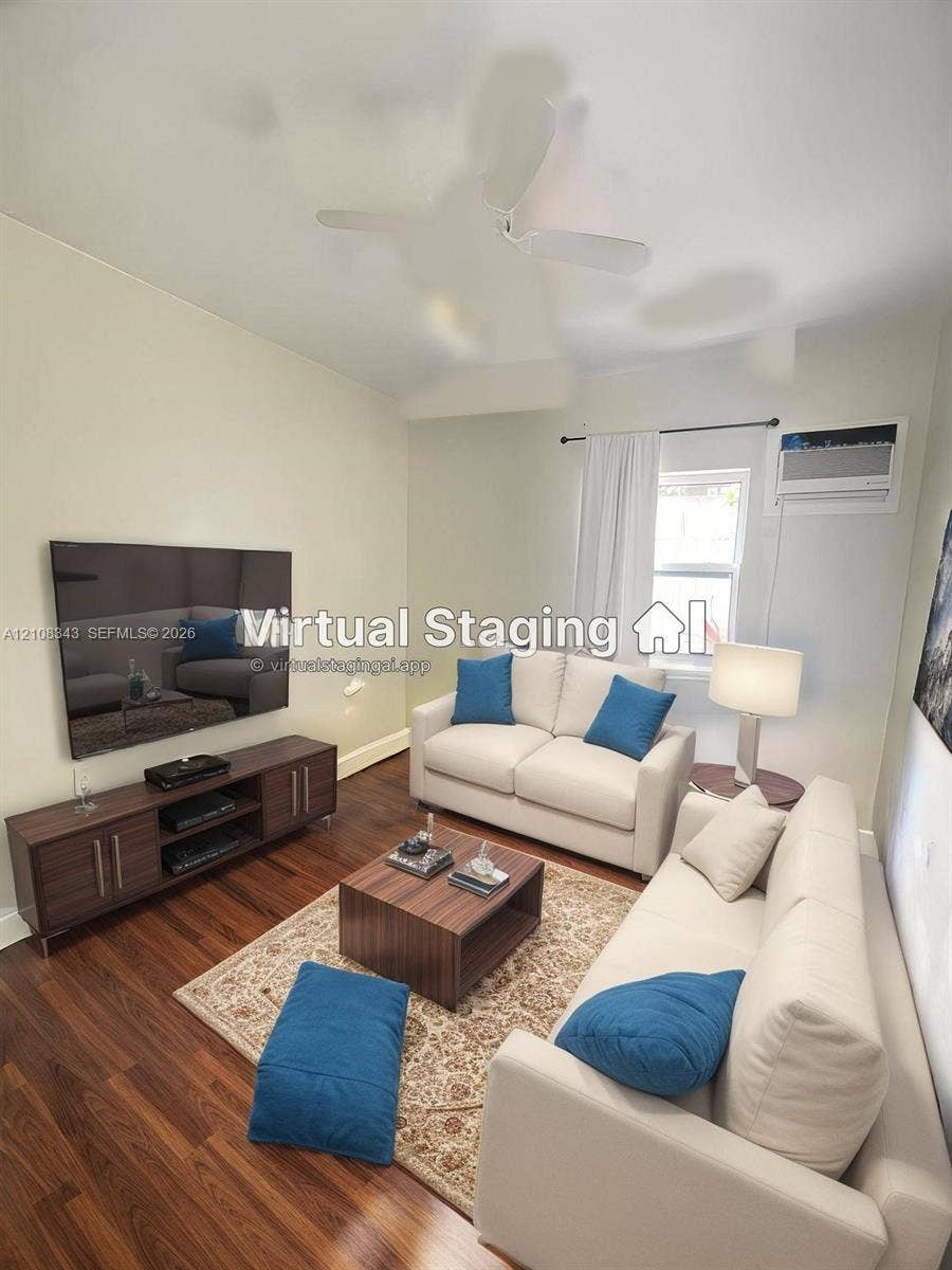 1935 Liberty Street, #3, Hollywood, Hollywood, FL 33020 Wood-finish flooring, white ceiling fan, and wall-mounted air conditioning unit
