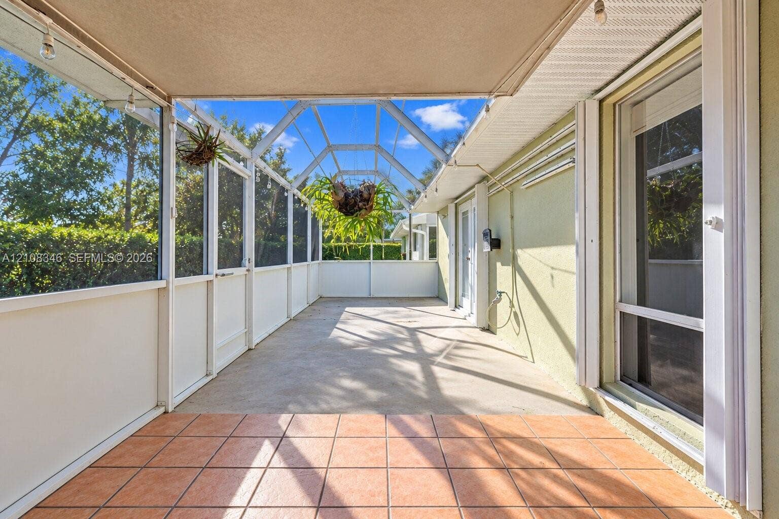 2530 SE 7th Place, Homestead, FL 33033 Screened-in lanai orchid area