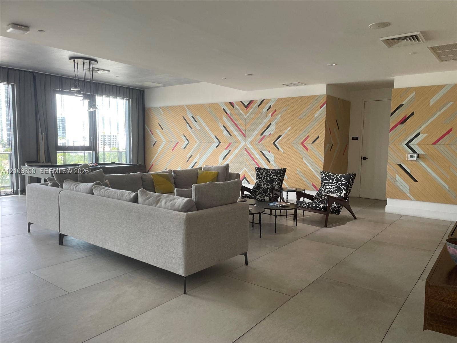 121 NE 34th Street, #1403, Miami, Miami, FL 33137 Large-format tile flooring, geometric wall paneling, and recessed ceiling lighting