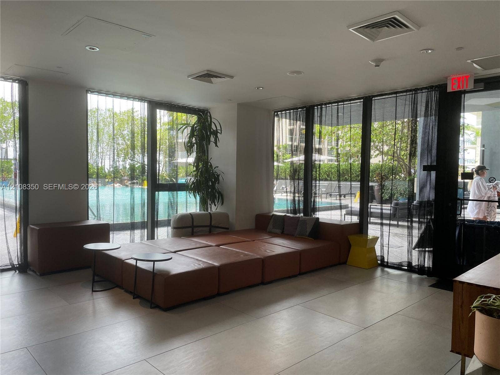 121 NE 34th Street, #1403, Miami, Miami, FL 33137 Common area featuring floor-to-ceiling windows, large-format tile flooring, and recessed ceiling lighting