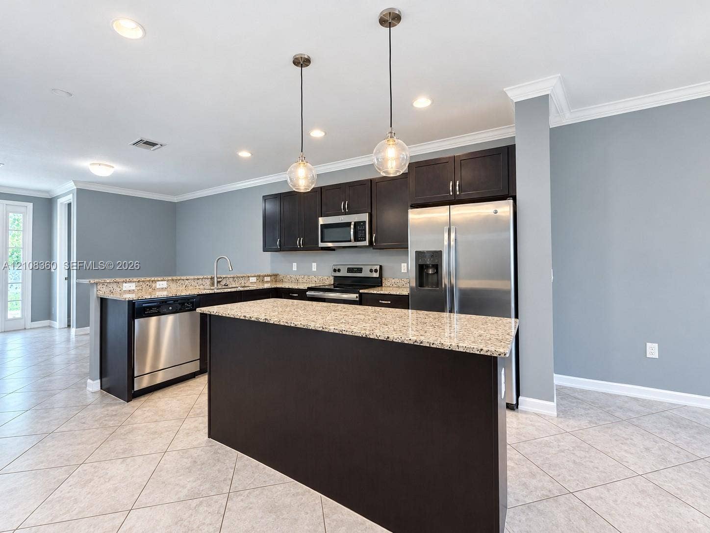 4608 Tara Cove Way, #4608, West Palm Beach, West Palm Beach, FL 33417 Kitchen featuring dark cabinetry, stone-surface countertops, stainless steel appliances, a central island, and globe pendant lighting