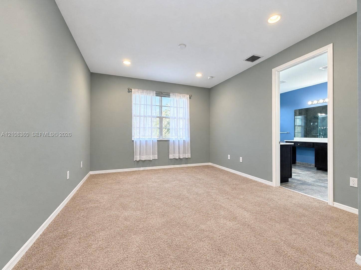 4608 Tara Cove Way, #4608, West Palm Beach, West Palm Beach, FL 33417 Spacious interior featuring neutral-toned carpeting, recessed lighting, and a window with exterior exposure
