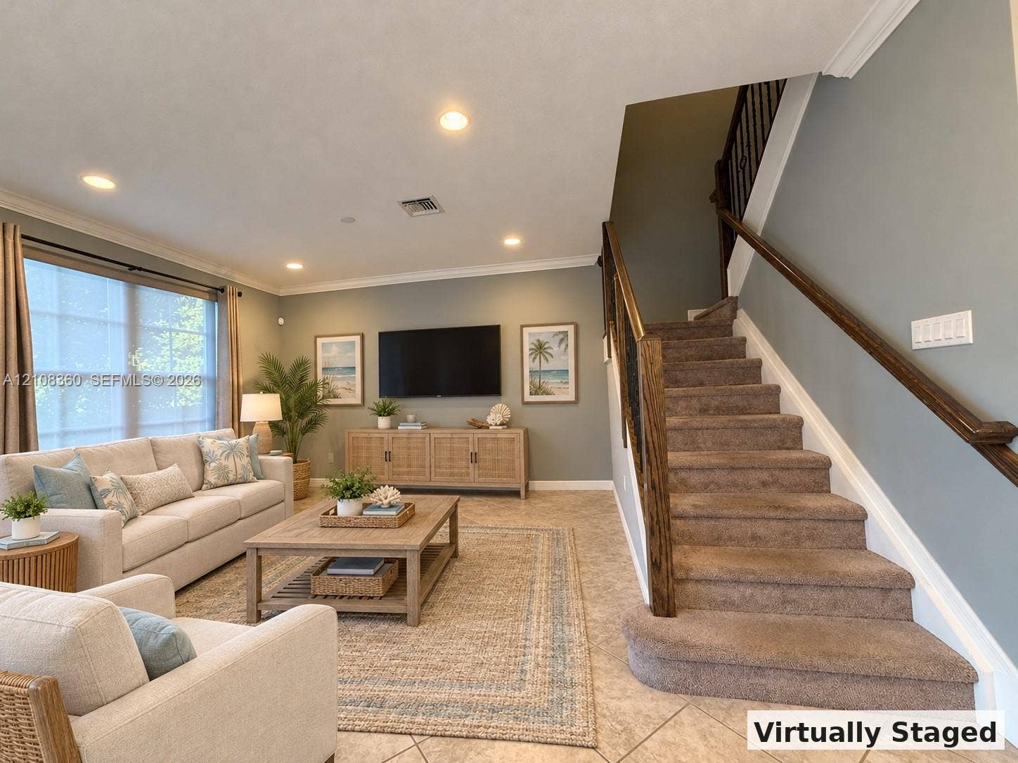 4608 Tara Cove Way, #4608, West Palm Beach, West Palm Beach, FL 33417 Open-concept interior featuring large-format tile flooring, recessed lighting, crown molding, and a staircase with stained wood handrails and metal balusters