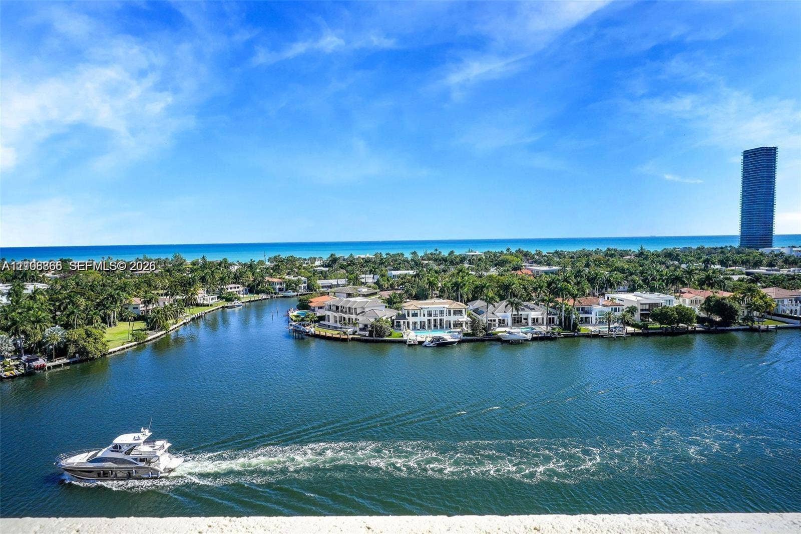 20165 NE 39 Place, #403, Aventura, FL 33180 Panoramic waterfront location featuring deep-water canal access, mature landscaping, and an open horizon toward the ocean