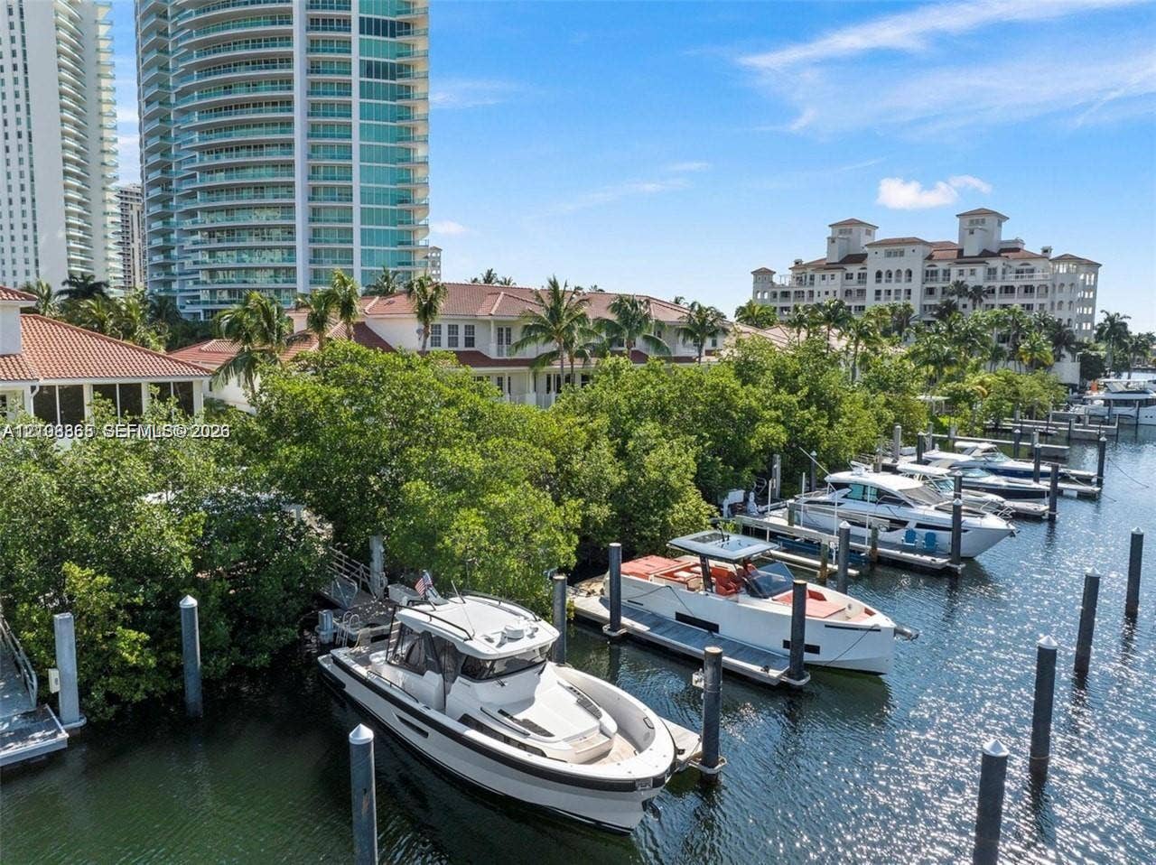 20165 NE 39 Place, #403, Aventura, FL 33180 Deep-water canal access featuring multiple fixed pilings and a private docking area