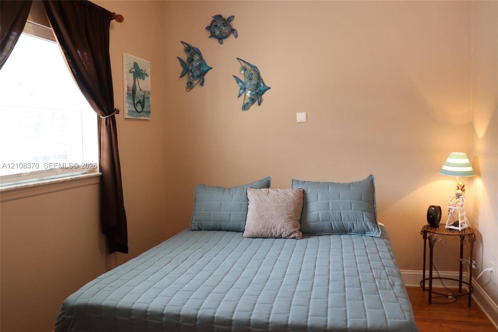 18901 SW 63rd Street, Southwest Ranches, FL 33332 Room featuring neutral-toned walls, hardwood flooring, and a window with a stone sill