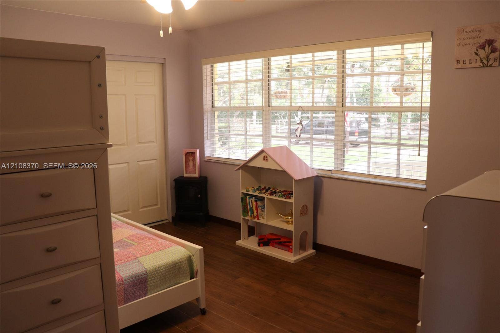 18901 SW 63rd Street, Southwest Ranches, FL 33332 Wood-finish flooring, multi-pane window with integrated blinds, and ceiling fan with integrated lighting fixture