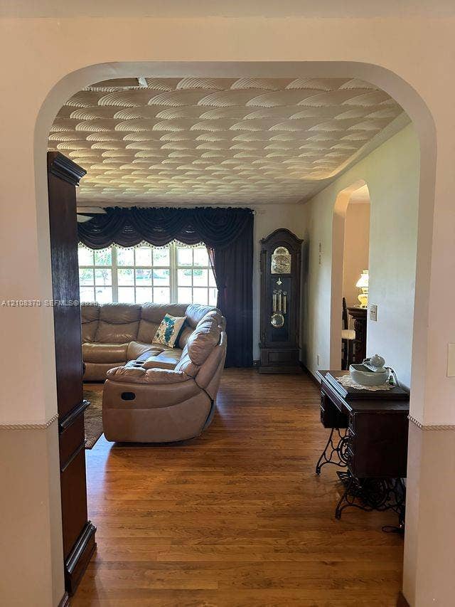18901 SW 63rd Street, Southwest Ranches, FL 33332 Arched doorways, wood-finish flooring, and textured decorative ceiling