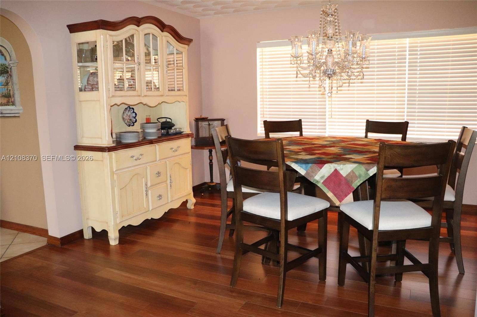 18901 SW 63rd Street, Southwest Ranches, FL 33332 Wood-finish flooring, crystal-style chandelier, and an arched wall opening