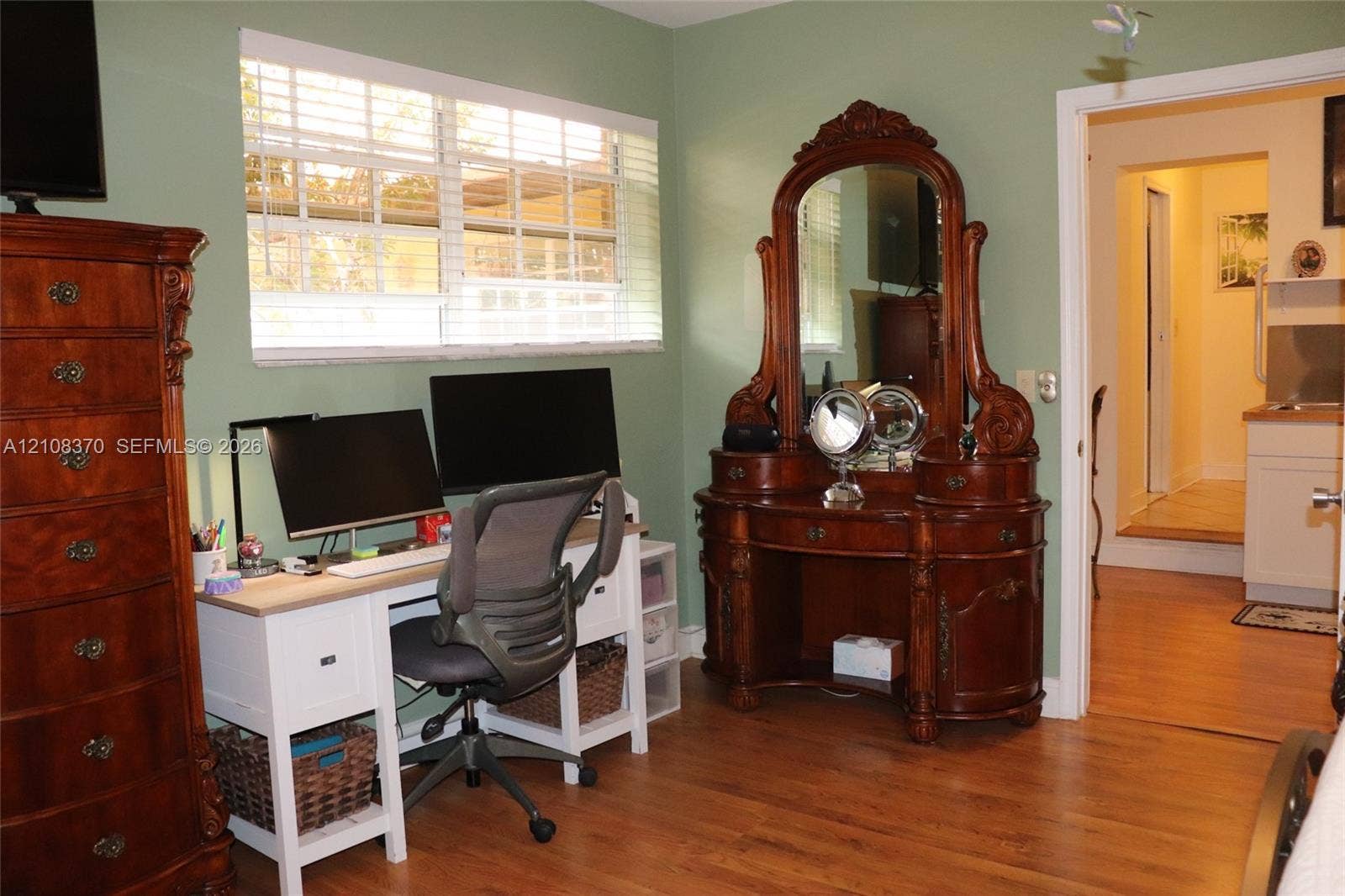 18901 SW 63rd Street, Southwest Ranches, FL 33332 Room featuring wood-finish flooring and a horizontal window with slatted blinds