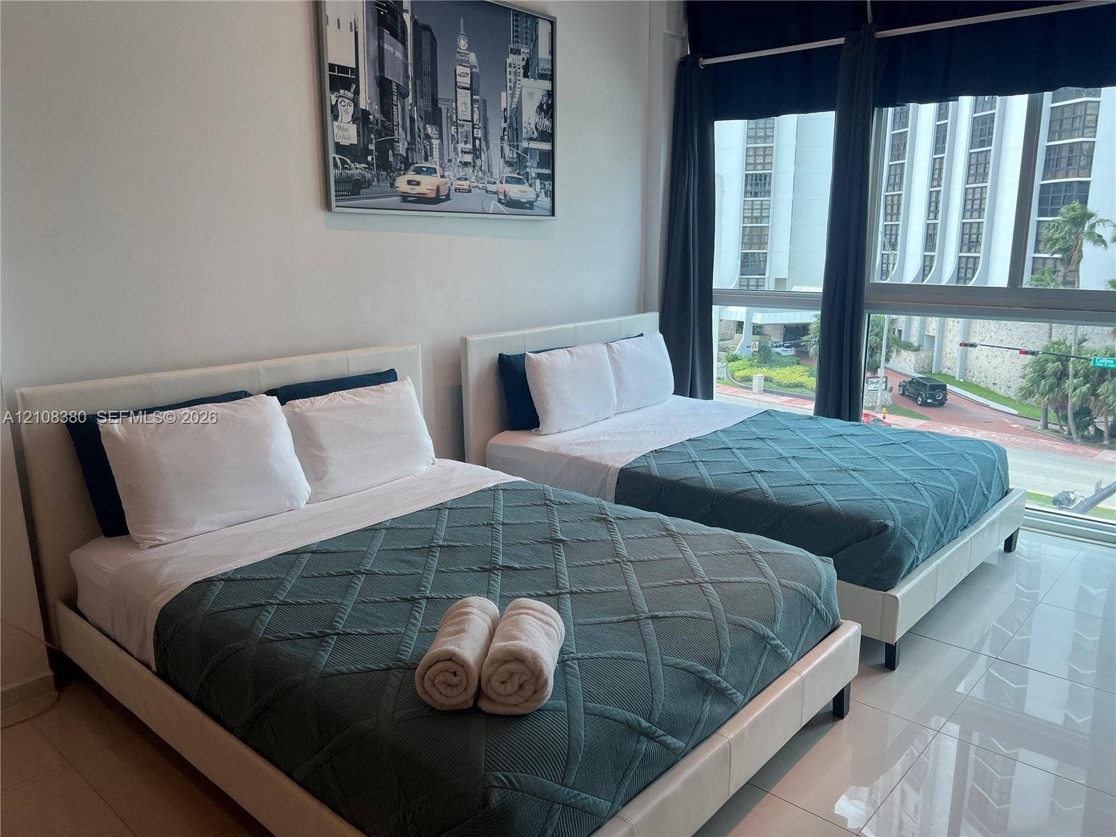 5445 Collins Avenue, #BAY11, Miami Beach, FL 33140 Floor-to-ceiling windows featuring expansive exterior exposure and polished tile flooring