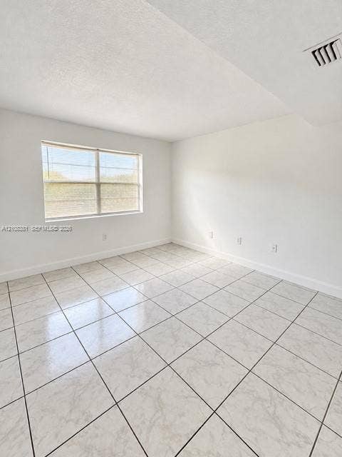 621 NW 177th Street, #101, Miami Gardens, Miami Gardens, FL 33169 Walk-in closet featuring ceramic tile flooring, dual-level wire shelving, and a flush-mount ceiling light fixture
