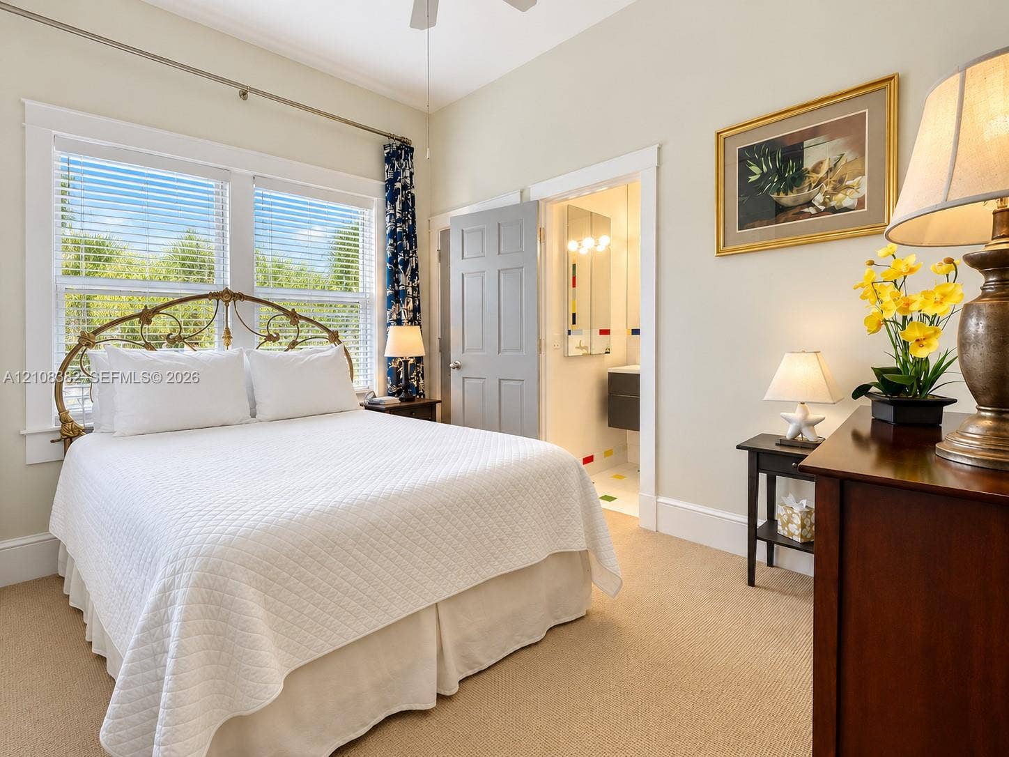 1701 S Olive Avenue, West Palm Beach, FL 33401 Bedroom featuring neutral wall color, plush carpeting, high ceilings with a mounted fan, and large windows with multi-pane glass