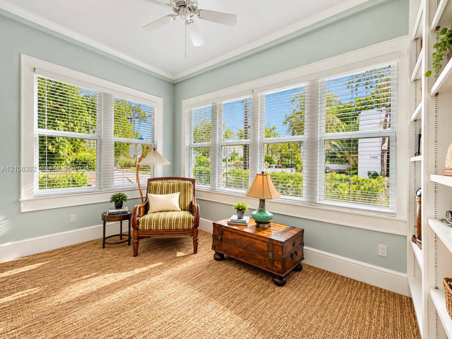 1701 S Olive Avenue, West Palm Beach, FL 33401 Multi-pane windows, built-in shelving, white ceiling fan, and extensive trim work