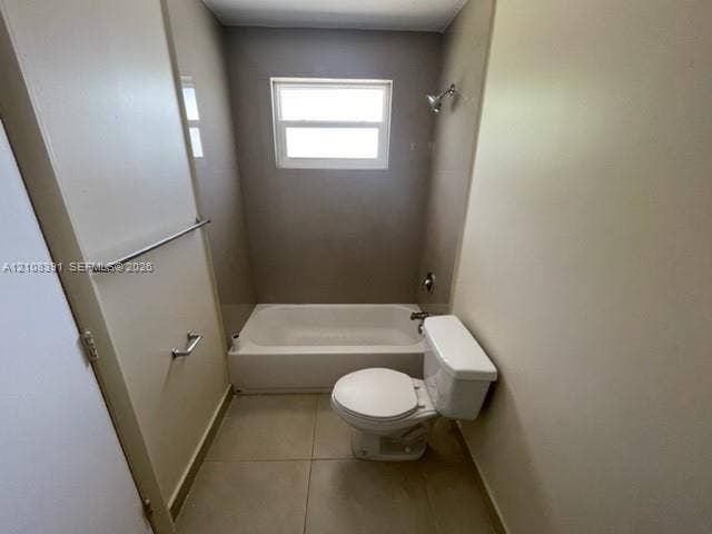 18233 Oleta Drive, #18233, North Miami Beach, North Miami Beach, FL 33160 Full-sized bathtub with surround, large-format tile flooring, window, and chrome-finish hardware
