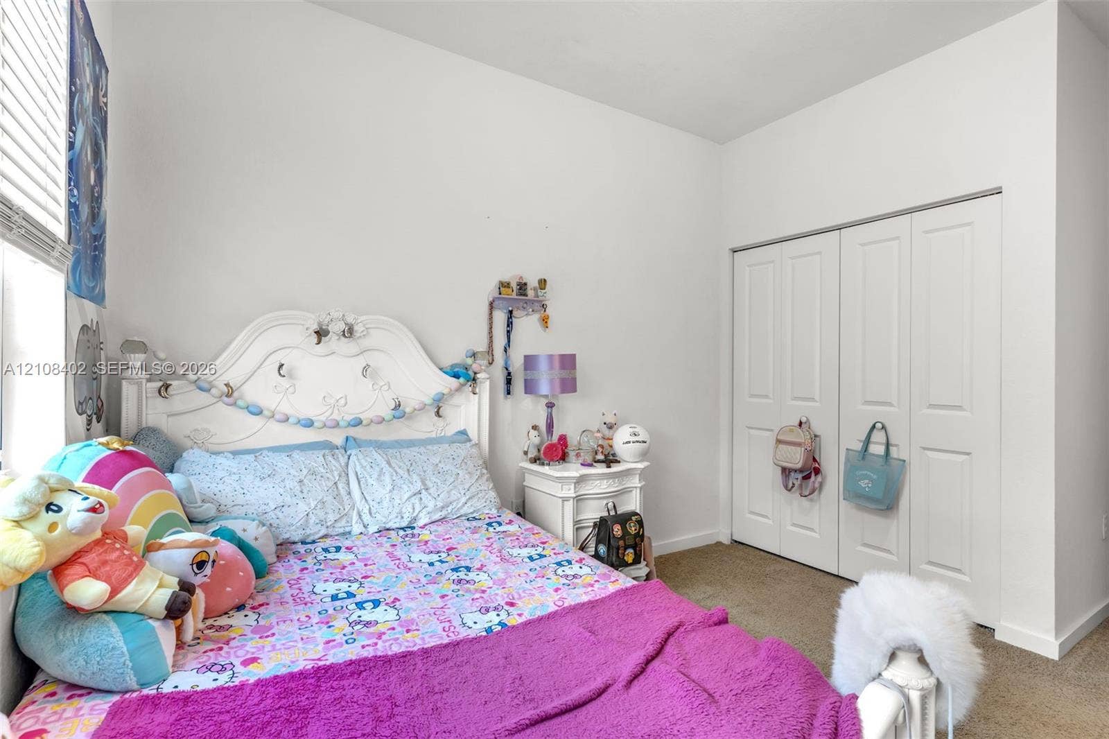 11771 SW 243rd Street, Homestead, FL 33032 Room featuring neutral-toned carpeting, high ceilings, and a double-door closet
