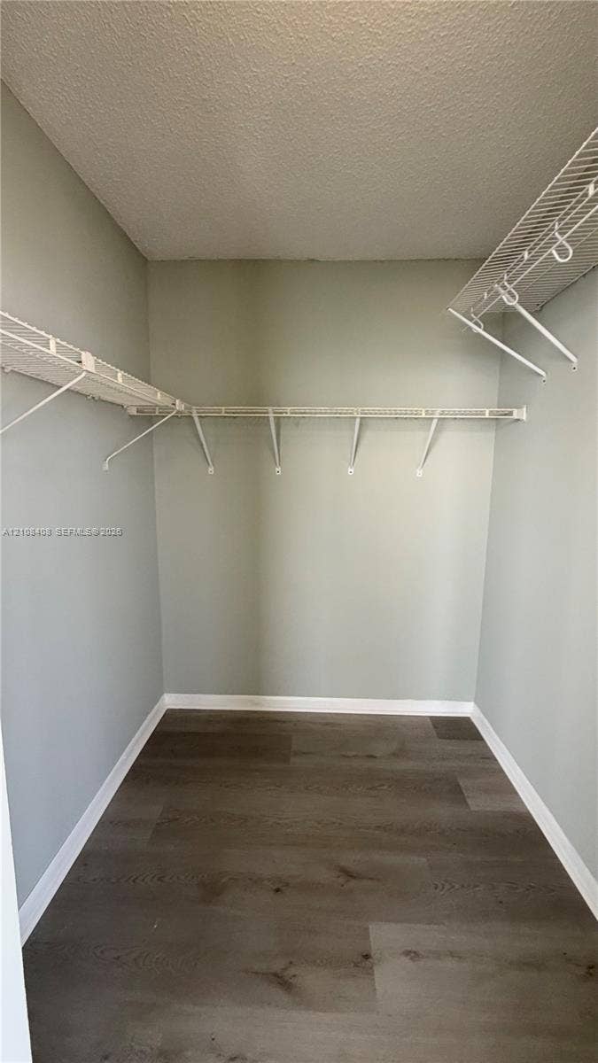 7601 E Treasure Drive, #618, North Bay Village, North Bay Village, FL 33141 Walk-in closet featuring wood-finish flooring and white wire shelving