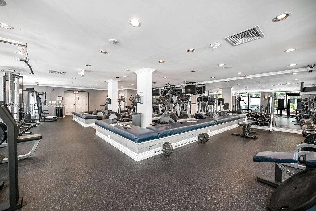 1900 Van Buren Street, #303B, Hollywood, Hollywood, FL 33020 Fitness space featuring rubberized flooring, recessed lighting, and wall-to-wall mirrors