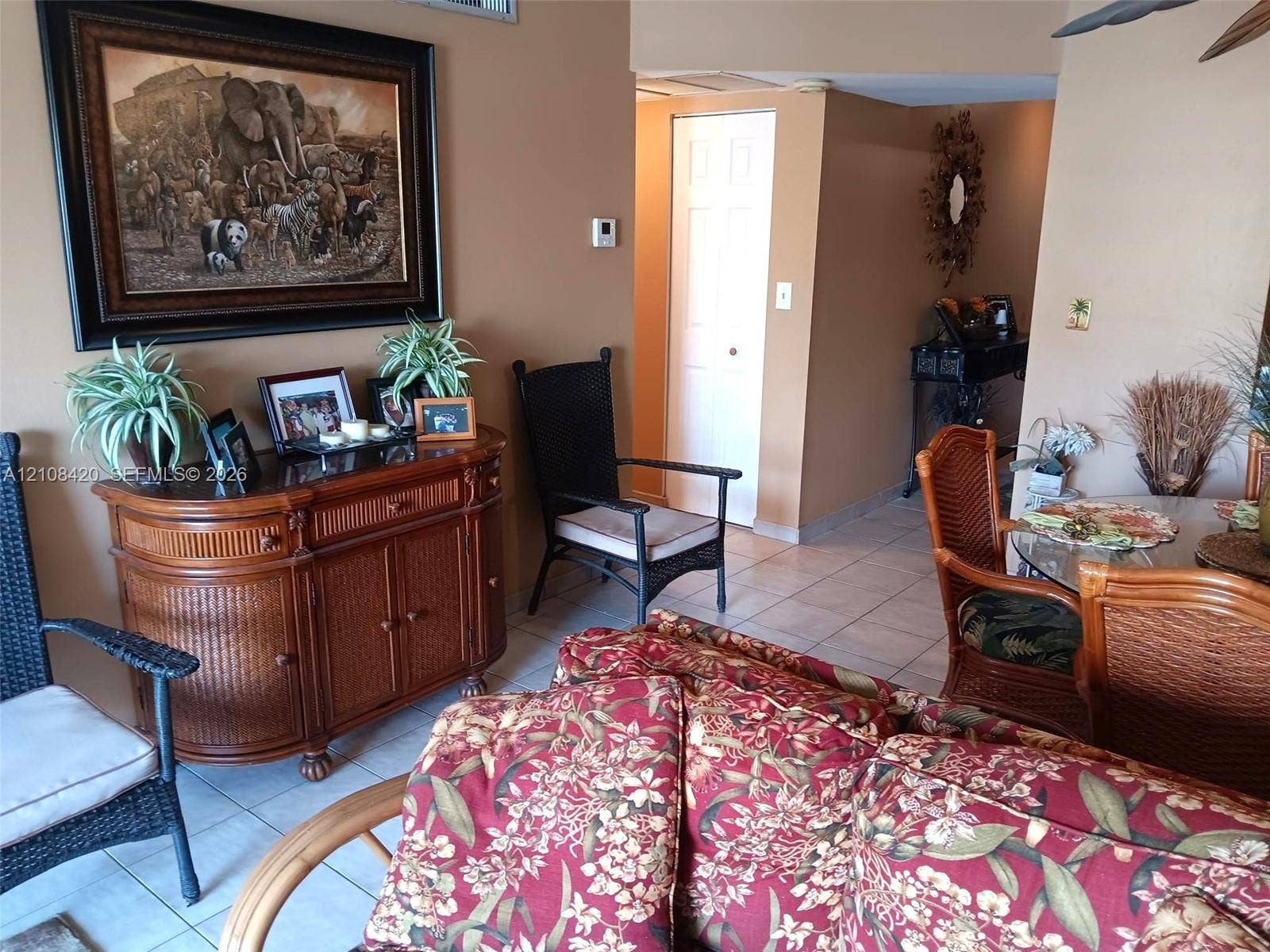 3545 NE 166th Street, #306, North Miami Beach, FL 33160 Interior space featuring neutral-toned walls, tile flooring, and a six-panel interior door