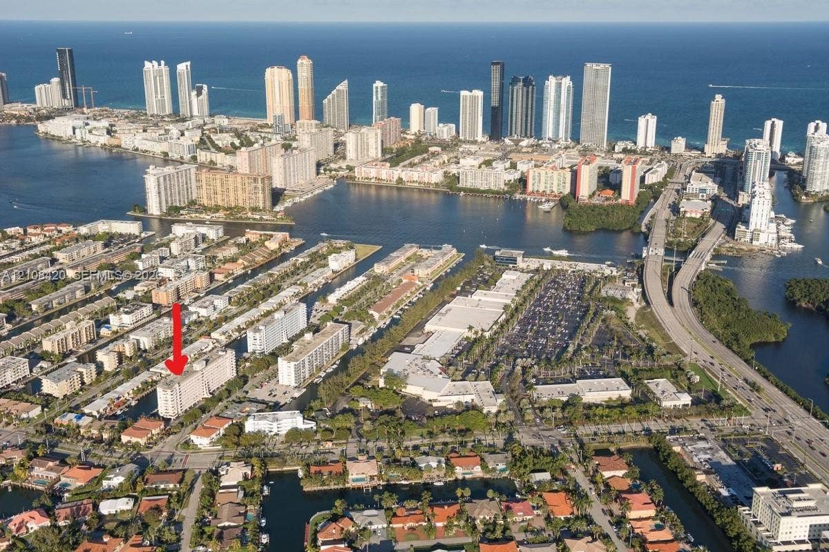 3545 NE 166th Street, #306, North Miami Beach, FL 33160 Aerial perspective featuring proximity to coastal waterways and high-density urban infrastructure