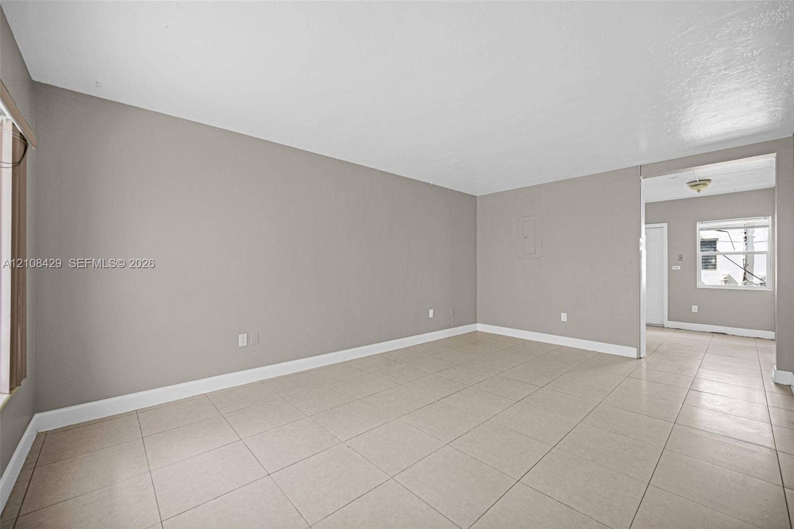 1430 NE 171st Street, North Miami Beach, FL 33162 Neutral interior featuring ceramic tile flooring, smooth-finish walls, and a recessed ceiling lighting fixture