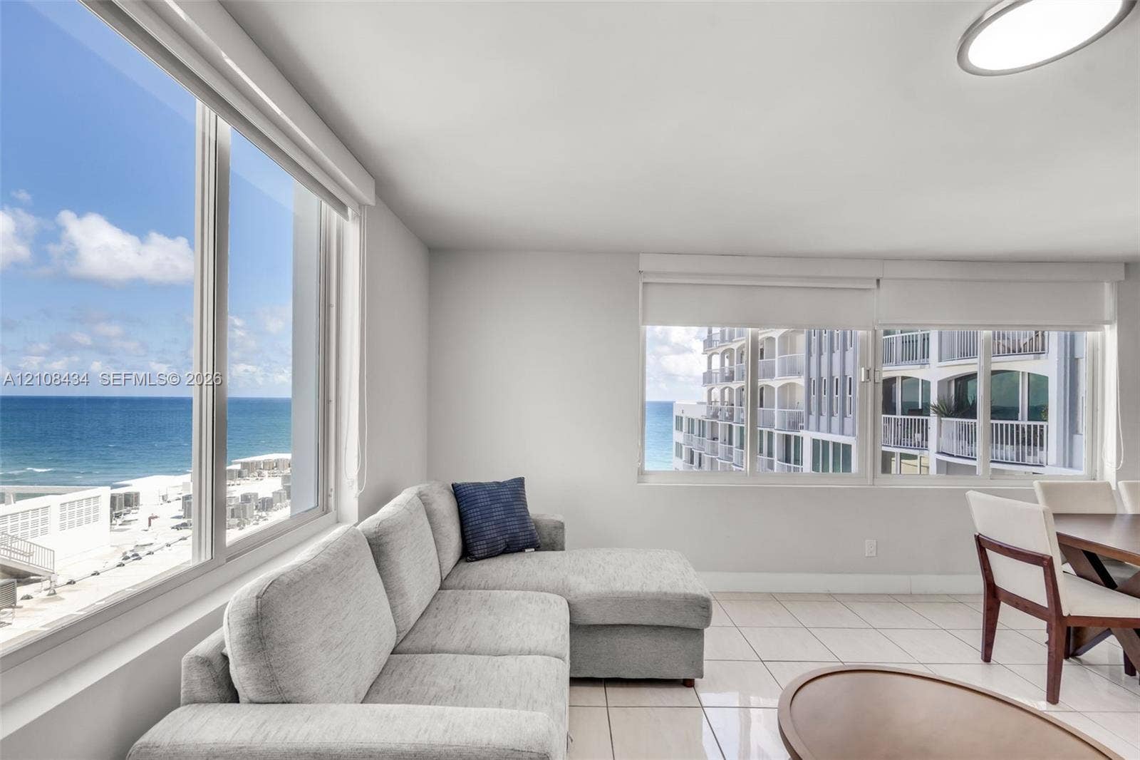Miami Beach, FL 33140 Floor-to-ceiling windows featuring ocean scenery, ceramic tile flooring, and integrated recessed lighting