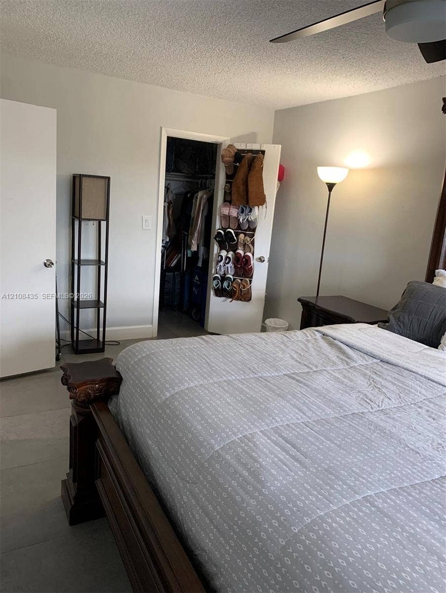 4275 S Tamiami Canal Drive, #2-314, Miami, Miami, FL 33126 Room featuring neutral wall paint, solid-core interior doors, and a ceiling fan with integrated lighting