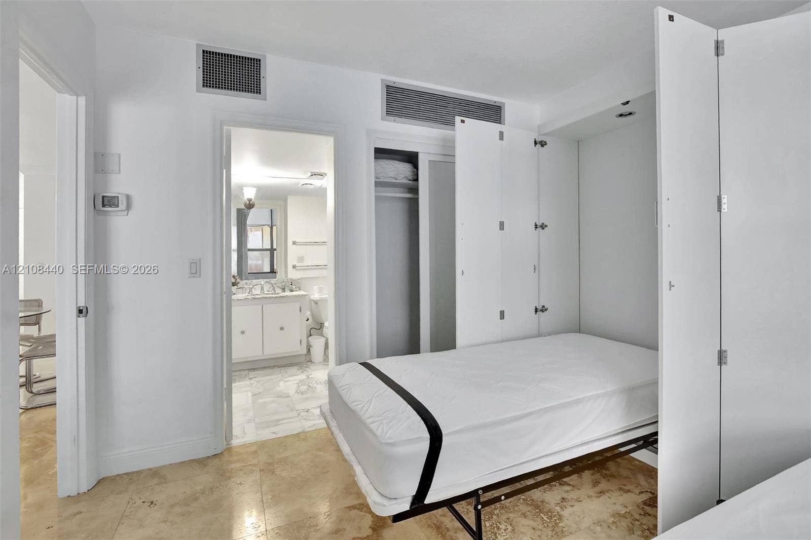 9801 Collins Avenue, #3T, Bal Harbour, Bal Harbour, FL 33154 Built-in white storage cabinetry, polished stone flooring, and recessed ceiling lighting